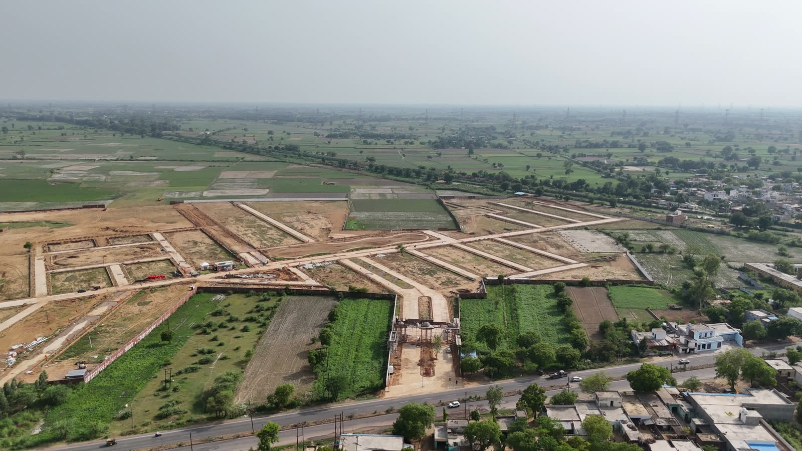 Aerial view of plotted layout and roads at the Golden City site